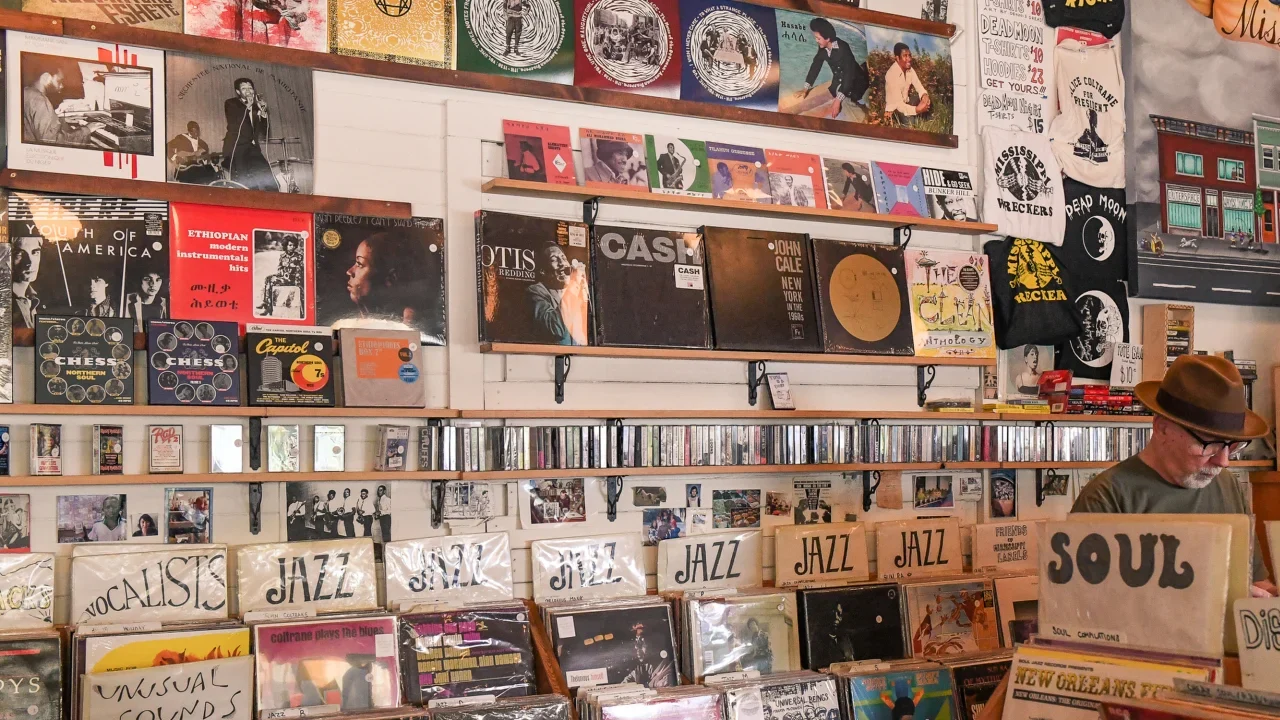 Image of a record store with vinyls from ceiling to floor. Imaged source by Portland Record Stores